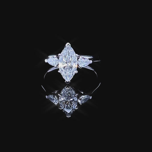 1.5 CARAT MARQUISE CENTRE TRIOLOGY RING