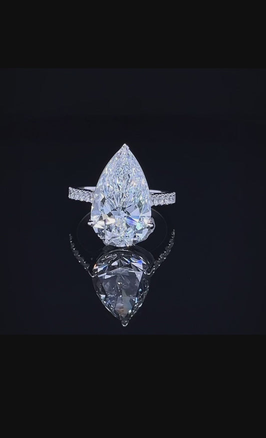 7CT PEAR WITH SIDE DIAMOND RING (ARJS3243)