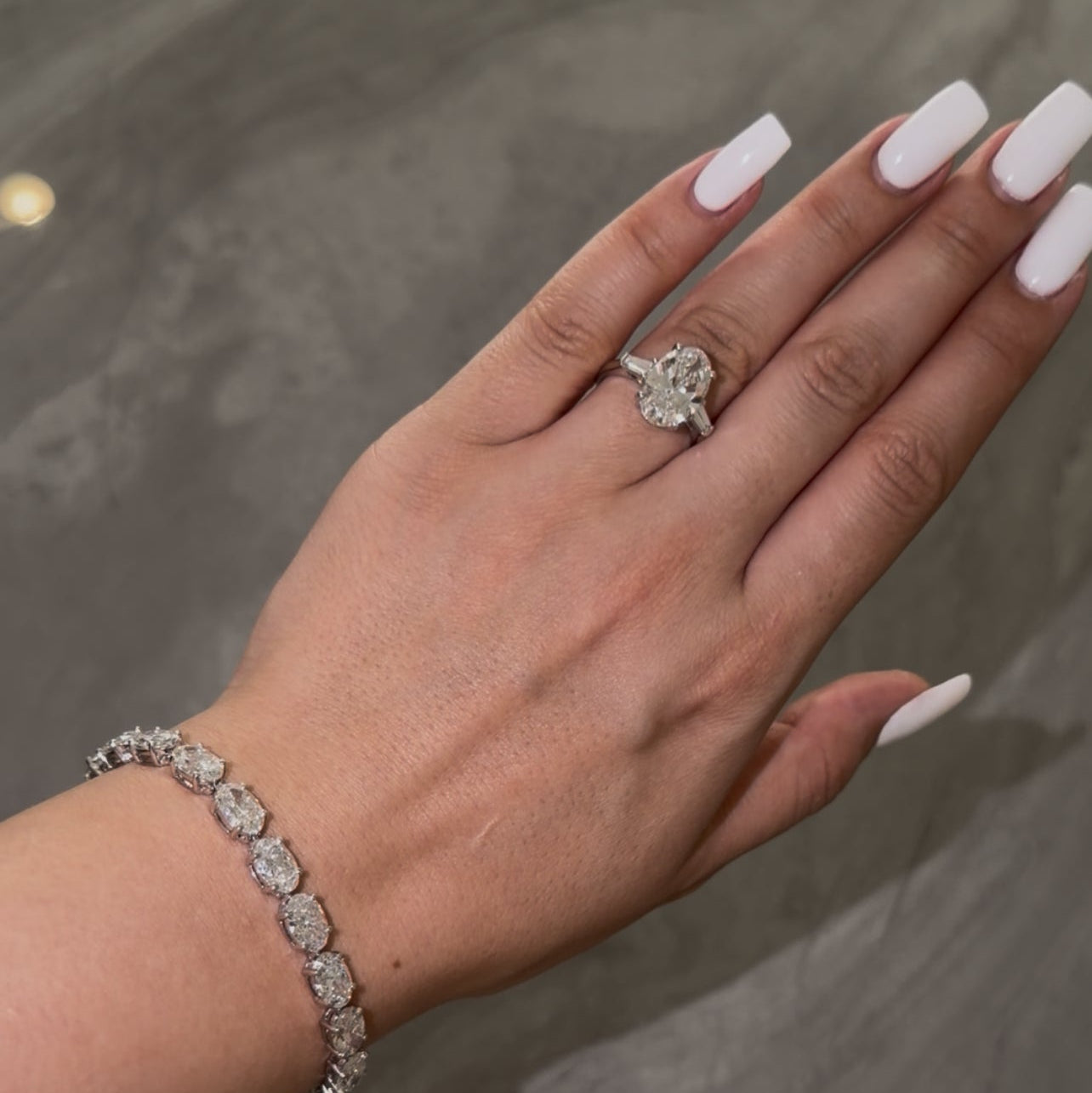 4CT OVAL DIAMOND RING WITH SIDE