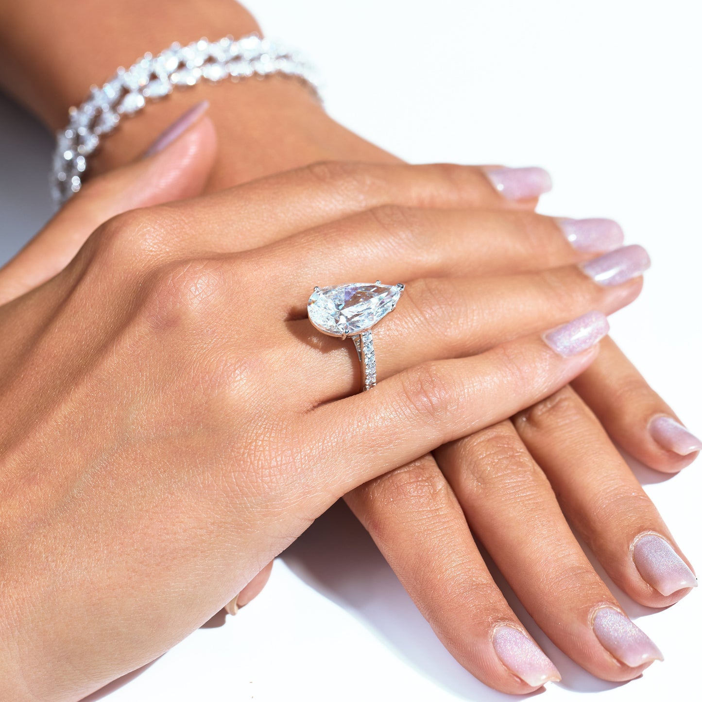7CT PEAR WITH SIDE DIAMOND RING (ARJS3435)
