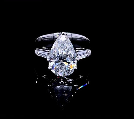 3CT PEAR WITH SIDE TUPPER BAGUETTE DIAMOND RING (ARJS3495)